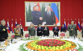 Toate sălile pe unde a trecut Șoigu decorate cu tablourile lui Putin de Kim Jong Un