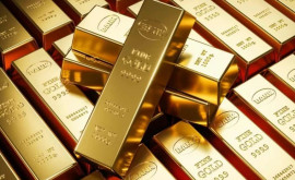 Prețul aurului scade în așteptarea declarațiilor din SUA