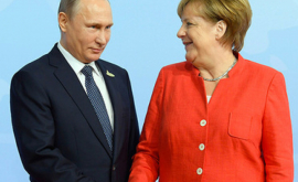Владимир Путин поздравил Ангелу Меркель с успехом блока 