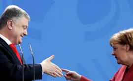 Moment rușinos la întîlnirea dintre Merkel şi Poroşenko